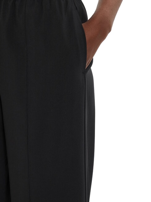 CK PERFORMANCE Palazzohose mit Logo-Gummizug schwarze Schönheit - Sportanzüge für Damen